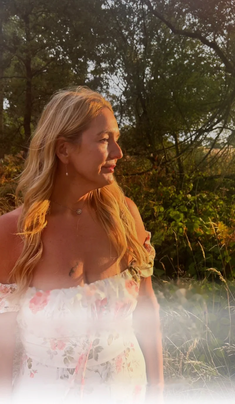 Victoria, the maker of Lavender and Love, in golden evening light among trees